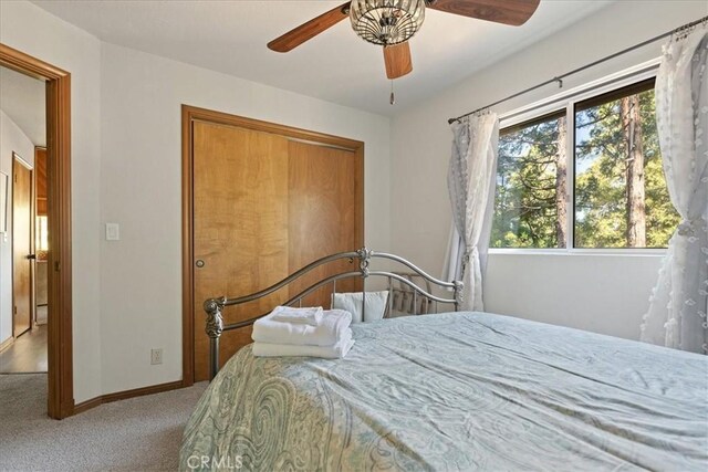 267 Pioneer Rd, Lake Arrowhead, CA 92317 - bedroom with multiple windows, carpet flooring, baseboards, and a ceiling fan