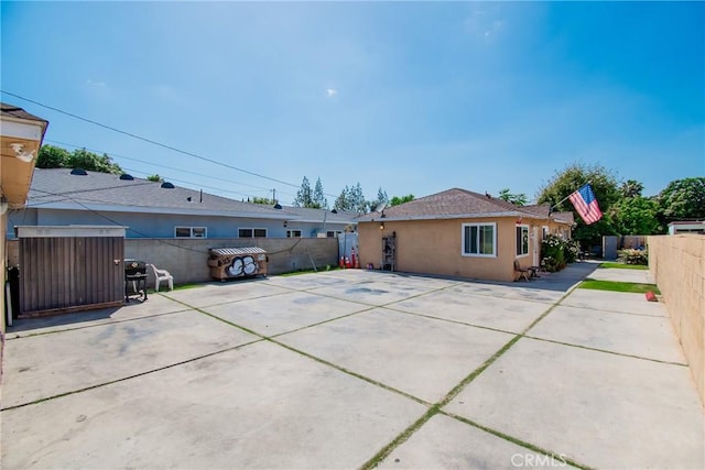 2743 Cogswell Rd, El Monte, CA 91732 - rear view of property featuring a fenced backyard, a patio, and stucco siding