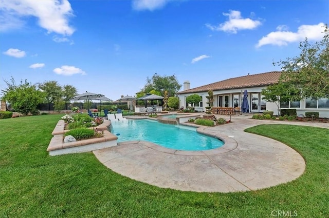 view of swimming pool with a gazebo, a patio area, a lawn, and a pool with connected hot tub