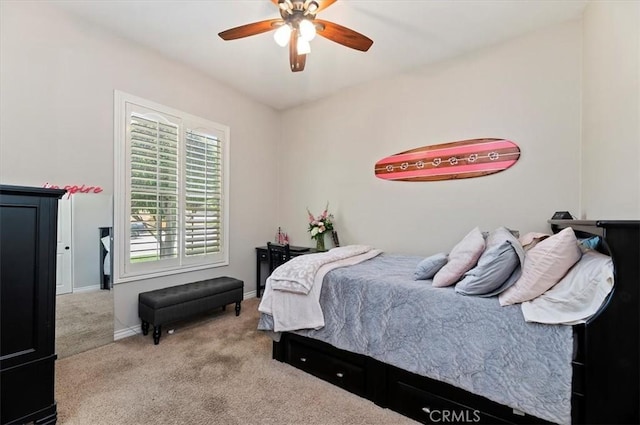 bedroom with carpet, baseboards, and ceiling fan