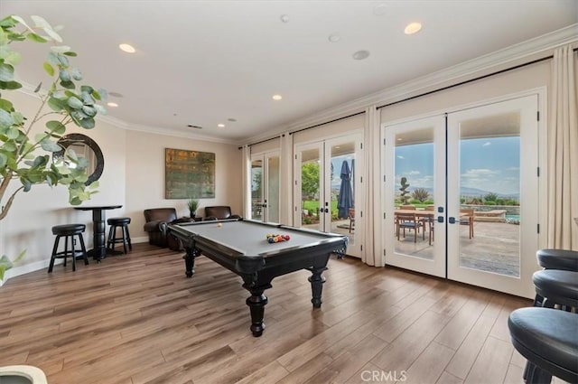 playroom featuring french doors, ornamental molding, billiards table, light wood-type flooring, and recessed lighting