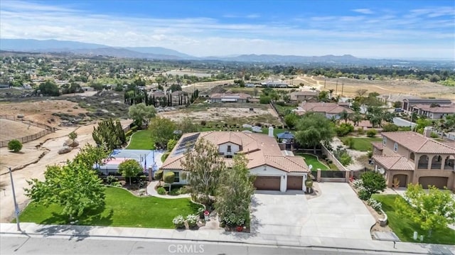 aerial view of residential area featuring mountains