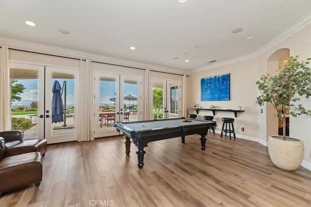 game room with french doors, crown molding, billiards, light wood-type flooring, and baseboards