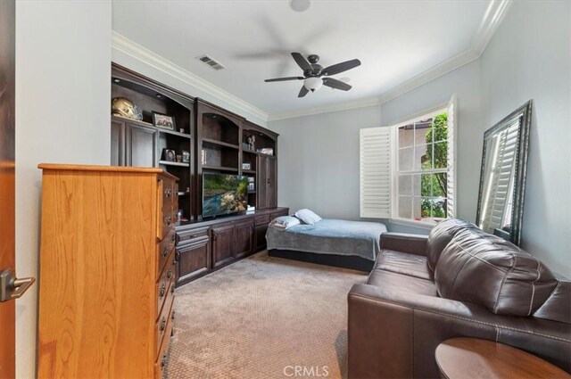 bedroom with light colored carpet, crown molding, and ceiling fan