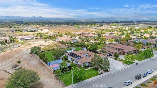 aerial perspective of suburban area with a mountain backdrop