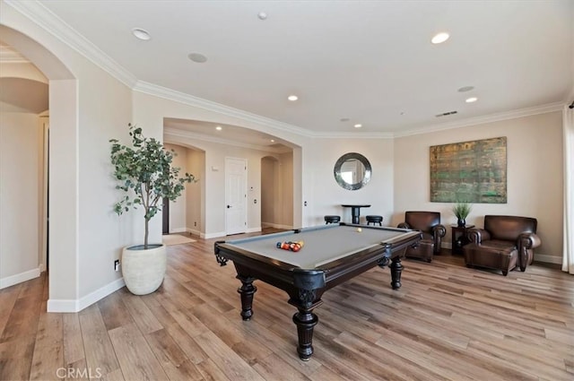 rec room featuring arched walkways, pool table, baseboards, light wood-type flooring, and crown molding