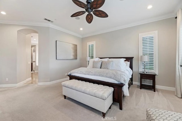 bedroom featuring light colored carpet, baseboards, ornamental molding, recessed lighting, and arched walkways