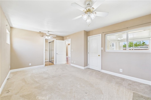 unfurnished bedroom with carpet flooring, baseboards, and ceiling fan
