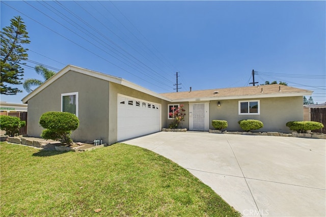 ranch-style home with stucco siding, driveway, a garage, and a front yard