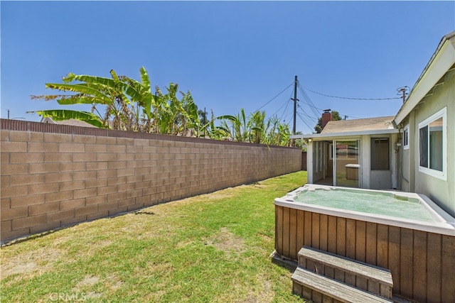 view of yard featuring a hot tub