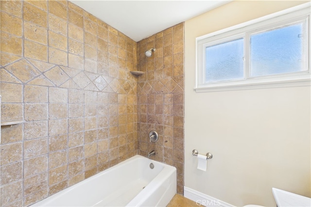 full bath with washtub / shower combination and baseboards