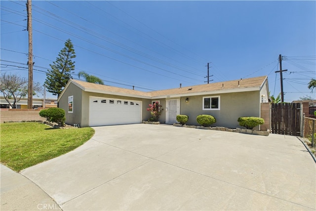 ranch-style home featuring stucco siding, driveway, and an attached garage