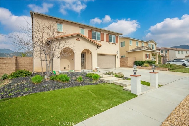 3344 Pokeroot Ln, San Bernardino, CA 92407 - mediterranean / spanish house featuring stucco siding, an attached garage, and concrete driveway