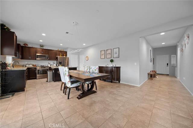 3344 Pokeroot Ln, San Bernardino, CA 92407 - dining room with recessed lighting, baseboards, and light tile patterned floors