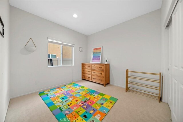 3344 Pokeroot Ln, San Bernardino, CA 92407 - rec room with light colored carpet, baseboards, and recessed lighting