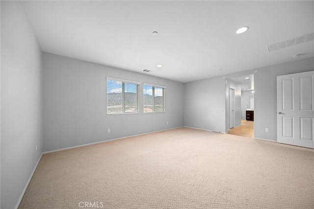 3344 Pokeroot Ln, San Bernardino, CA 92407 - unfurnished room with light carpet, baseboards, and recessed lighting