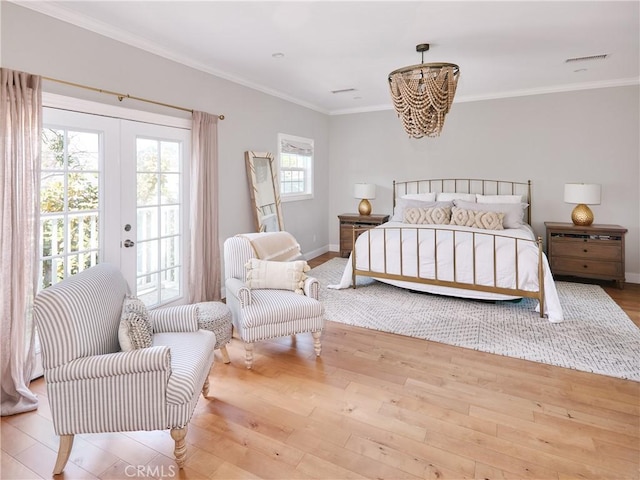 6443 W 81st St, Los Angeles, CA 90045 - bedroom with access to exterior, wood finished floors, a chandelier, crown molding, and french doors