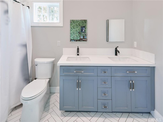6443 W 81st St, Los Angeles, CA 90045 - full bathroom with toilet, double vanity, baseboards, and a shower with curtain