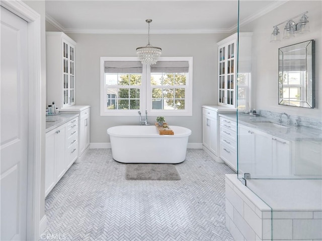 6443 W 81st St, Los Angeles, CA 90045 - full bathroom featuring two vanities, a freestanding tub, baseboards, a chandelier, and crown molding
