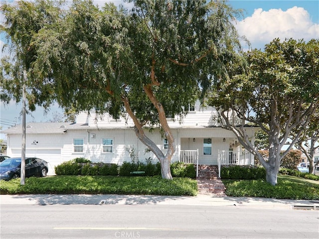 6443 W 81st St, Los Angeles, CA 90045 - view of front facade with an attached garage and a porch