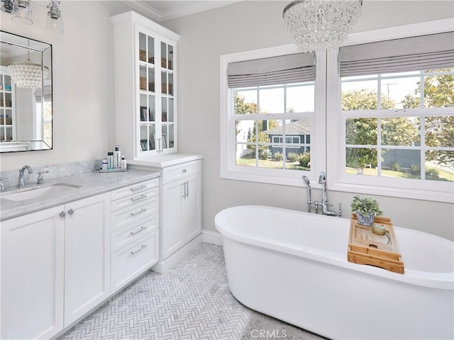 6443 W 81st St, Los Angeles, CA 90045 - bathroom with a chandelier, a freestanding tub, vanity, and baseboards