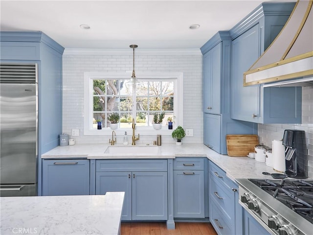 6443 W 81st St, Los Angeles, CA 90045 - kitchen with stainless steel built in fridge, wall chimney range hood, tasteful backsplash, a sink, and ornamental molding