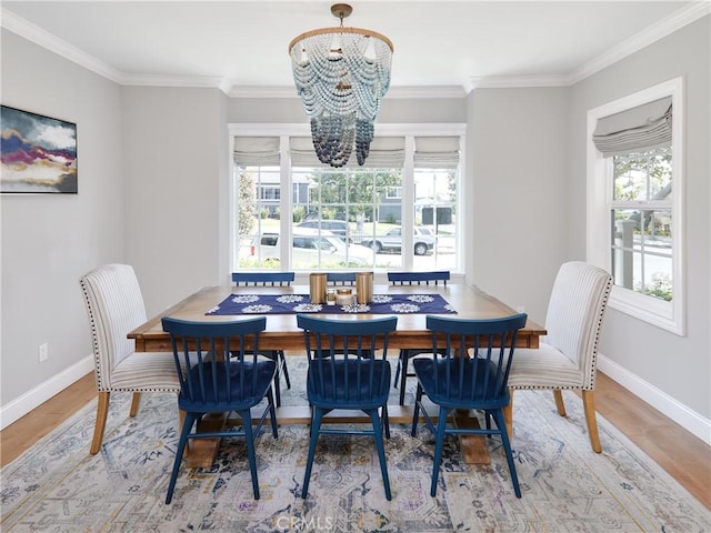 6443 W 81st St, Los Angeles, CA 90045 - dining space featuring crown molding, a chandelier, wood finished floors, and baseboards