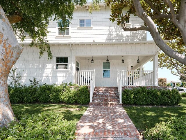 6443 W 81st St, Los Angeles, CA 90045 - view of front of home with covered porch and a front lawn
