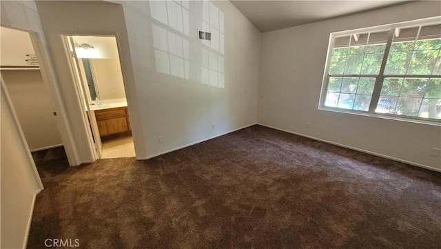 2364 S Cutty Way Unit 3, Anaheim, CA 92802 - unfurnished bedroom with dark carpet, a walk in closet, and ensuite bathroom