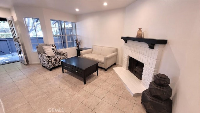 2364 S Cutty Way Unit 3, Anaheim, CA 92802 - living area featuring light tile patterned floors, a brick fireplace, healthy amount of natural light, and recessed lighting