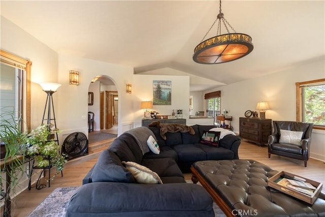 919 S Waldstrasse Way, Big Bear Lake, CA 92314 - living room with arched walkways, light wood-style flooring, and lofted ceiling