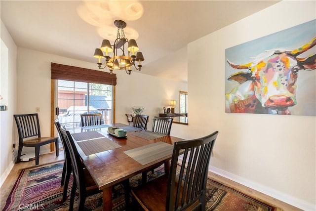919 S Waldstrasse Way, Big Bear Lake, CA 92314 - dining space featuring a chandelier, wood finished floors, and baseboards