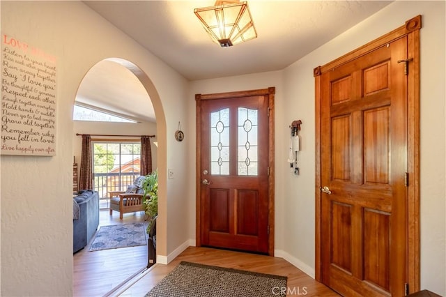 919 S Waldstrasse Way, Big Bear Lake, CA 92314 - foyer with light wood finished floors, arched walkways, and baseboards