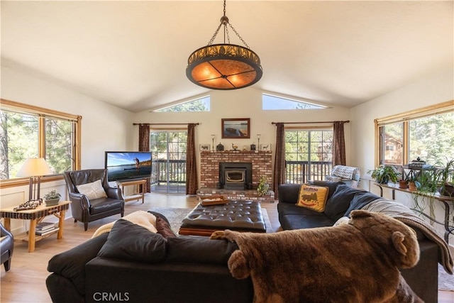 919 S Waldstrasse Way, Big Bear Lake, CA 92314 - living area featuring plenty of natural light, lofted ceiling, light wood-style floors, and a fireplace