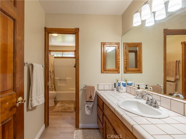 919 S Waldstrasse Way, Big Bear Lake, CA 92314 - full bathroom featuring wood finished floors, vanity, baseboards, and toilet