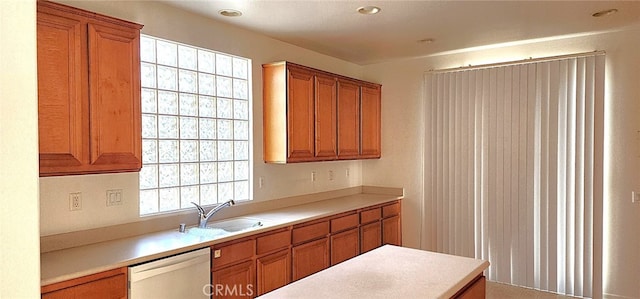 8281 Triplett Ln, Hemet, CA 92545 - kitchen featuring a sink, dishwasher, brown cabinets, and light countertops
