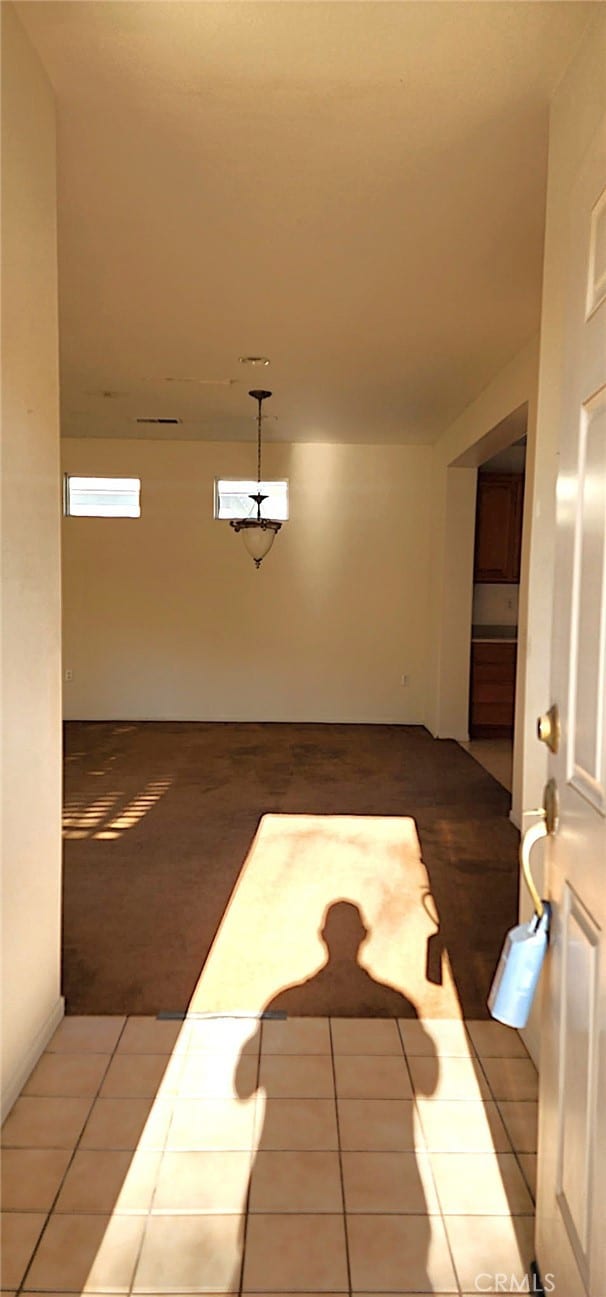 8281 Triplett Ln, Hemet, CA 92545 - unfurnished dining area with tile patterned floors