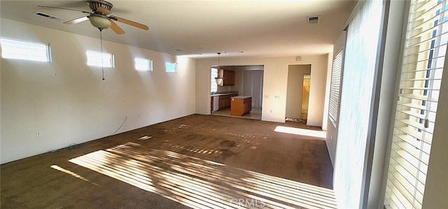 8281 Triplett Ln, Hemet, CA 92545 - unfurnished living room featuring ceiling fan and carpet floors