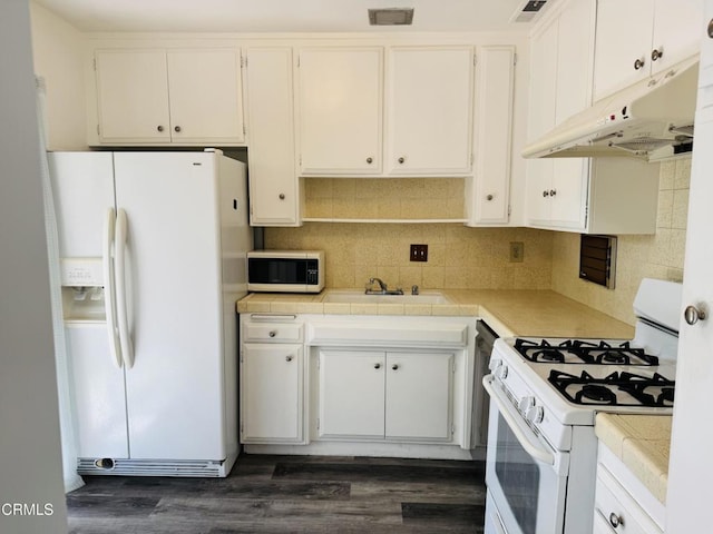 1810 Ramona Ave Unit 15, South Pasadena, CA 91030 - kitchen featuring white appliances, under cabinet range hood, tile counters, and dark wood-type flooring