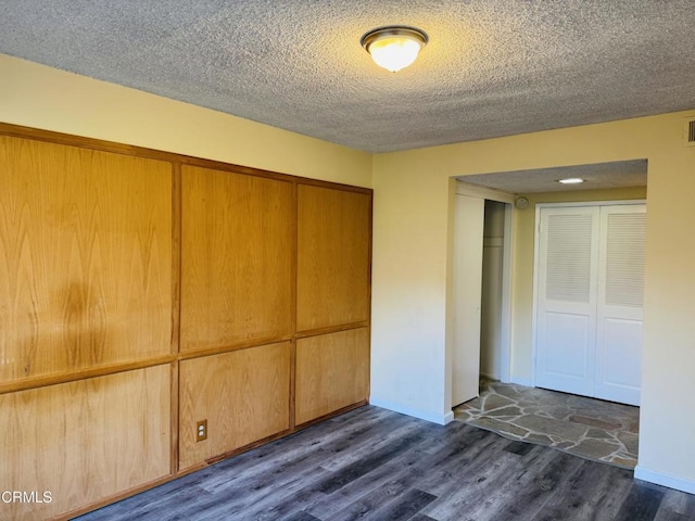 1810 Ramona Ave Unit 15, South Pasadena, CA 91030 - unfurnished bedroom featuring dark wood-style floors, a closet, and a textured ceiling