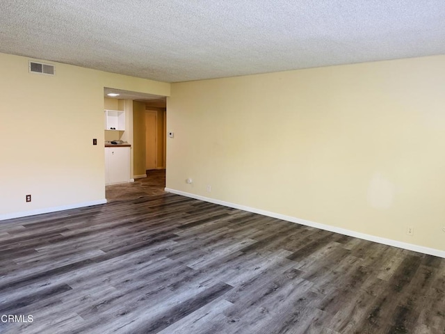 1810 Ramona Ave Unit 15, South Pasadena, CA 91030 - unfurnished room with dark wood-type flooring and a textured ceiling