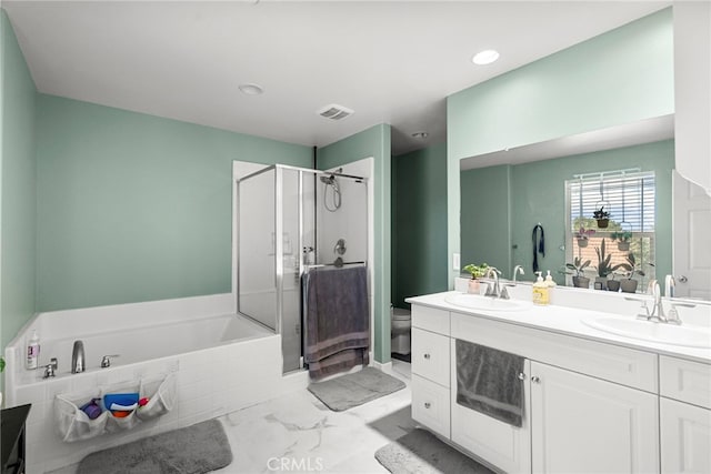 1021 Cambridge Ct, Lancaster, CA 93535 - full bath with a shower stall, a garden tub, marble look tile flooring, double vanity, and toilet