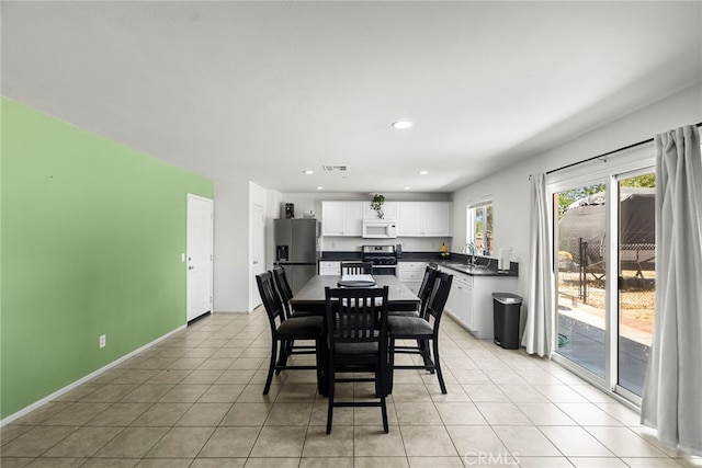1021 Cambridge Ct, Lancaster, CA 93535 - dining space featuring light tile patterned floors, recessed lighting, and baseboards