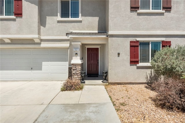 1021 Cambridge Ct, Lancaster, CA 93535 - entrance to property with stucco siding, an attached garage, and concrete driveway