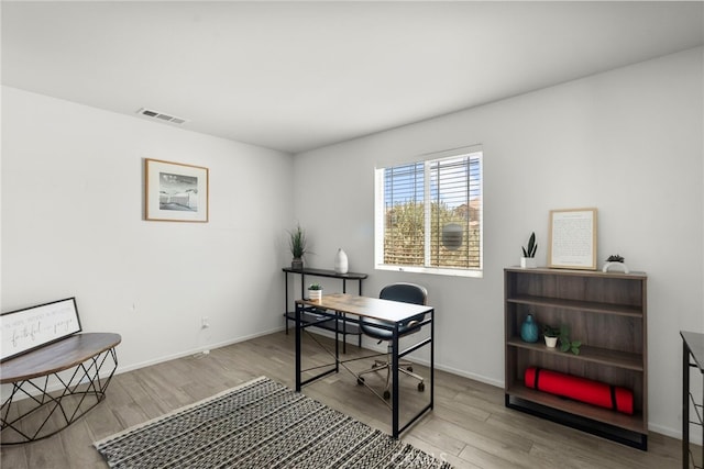 1021 Cambridge Ct, Lancaster, CA 93535 - office area featuring wood finished floors and baseboards