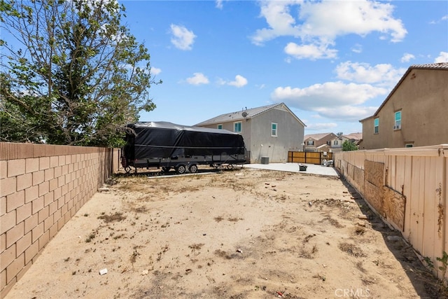 1021 Cambridge Ct, Lancaster, CA 93535 - back of house featuring a fenced backyard and a residential view