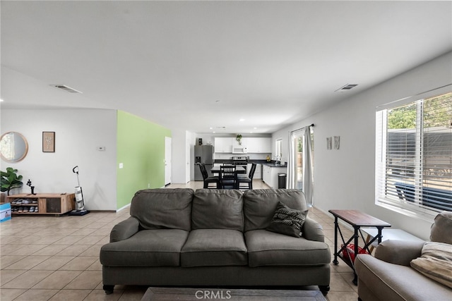1021 Cambridge Ct, Lancaster, CA 93535 - living room with light tile patterned floors and recessed lighting