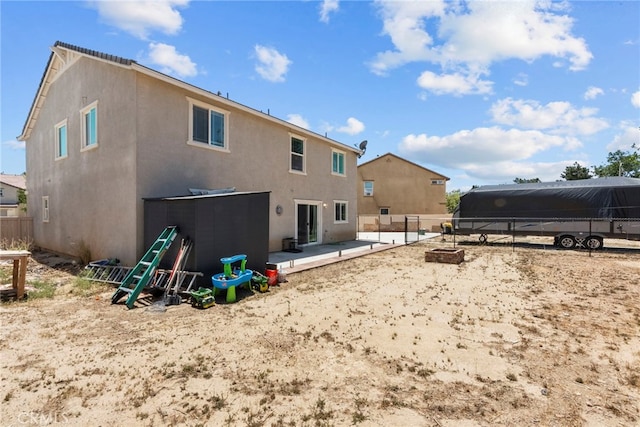 1021 Cambridge Ct, Lancaster, CA 93535 - rear view of house featuring stucco siding