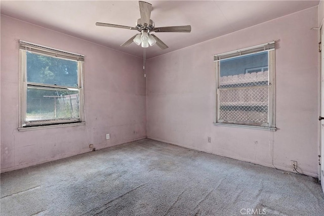 carpeted empty room with ceiling fan