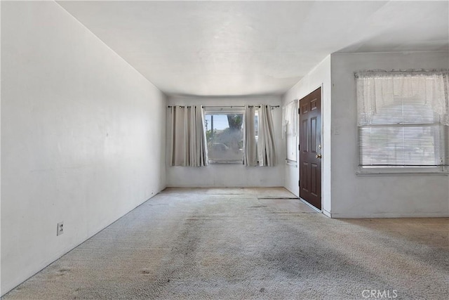 view of carpeted entrance foyer
